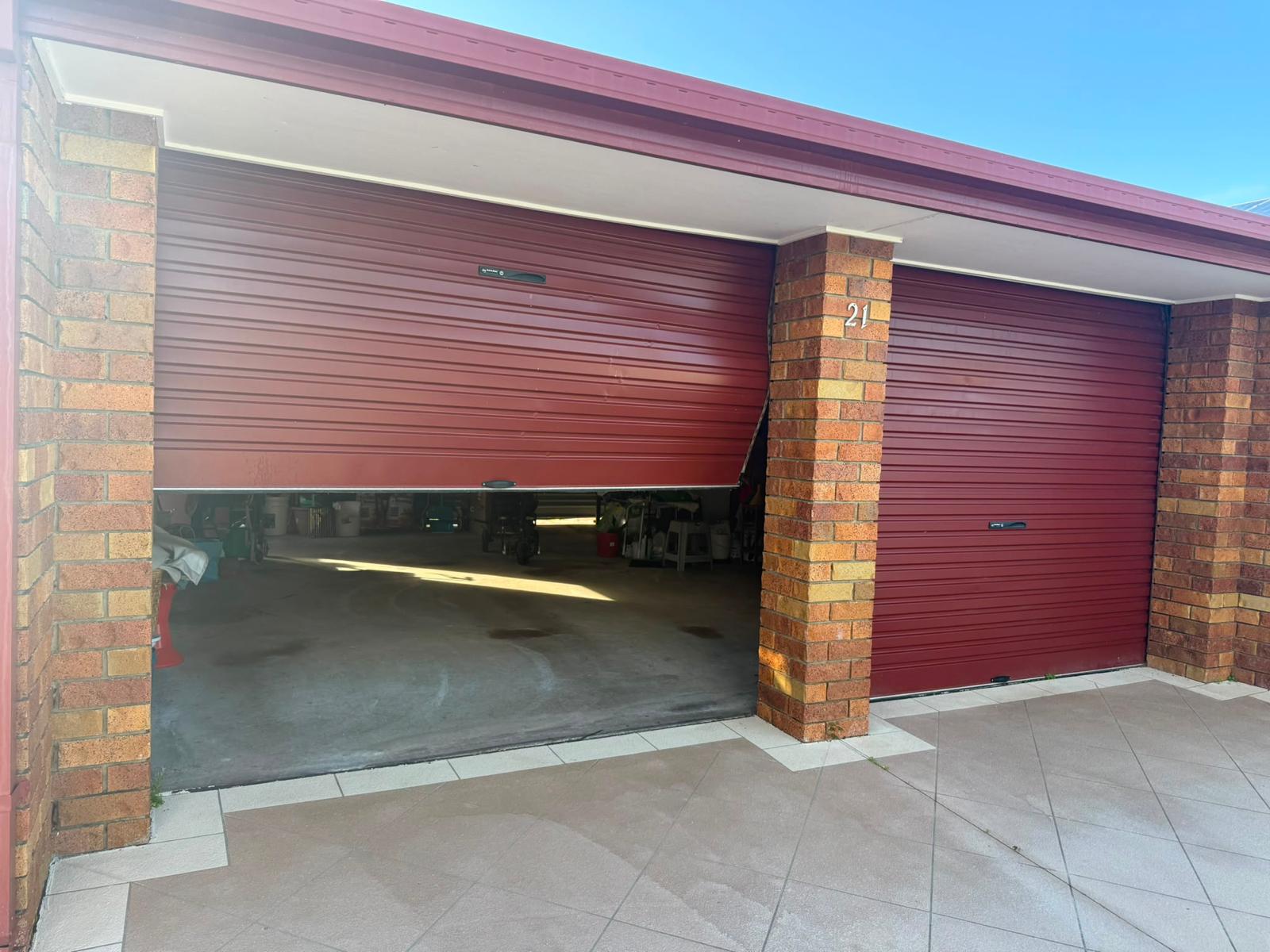 Before · roller door off track and jammed half open