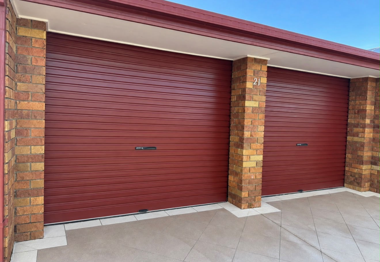 After · roller door repaired and running straight